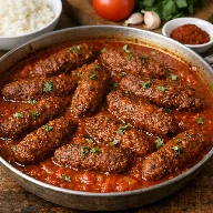 طريقة-عمل-كفتة أرز مصرية مقلية ومطهية في صلصة طماطم مسبكة